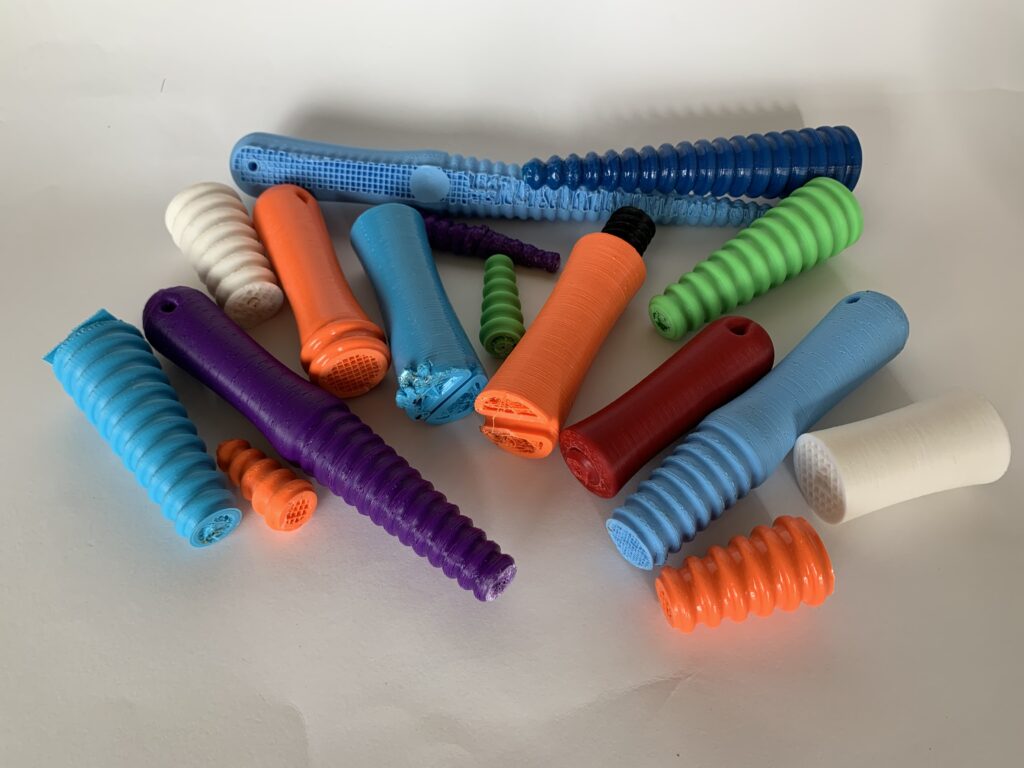 A colourful group of partially printed and broken felt fulling tools